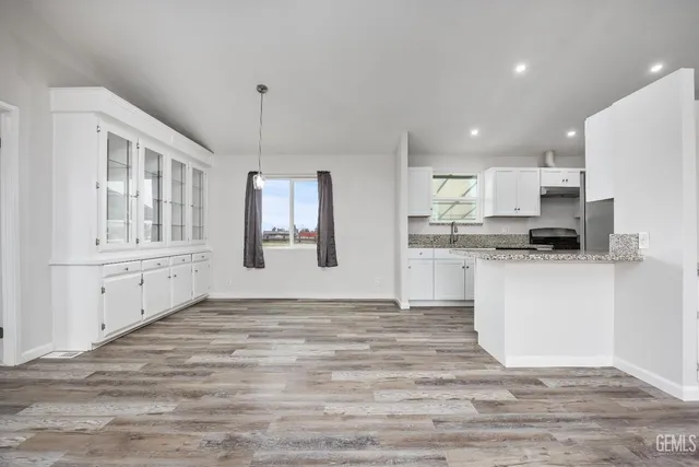 a view of a kitchen with electric appliances
