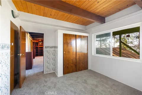 an empty room that has a large window