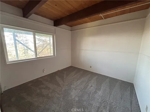 a view of a room that has a window in it