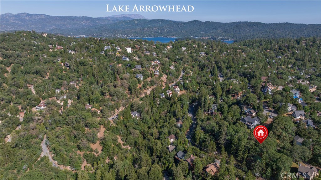1268 Aleutian Drive Lake Arrowhead, CA 92352 - Photo 32 of 33 a view of a lush green hillside and a building