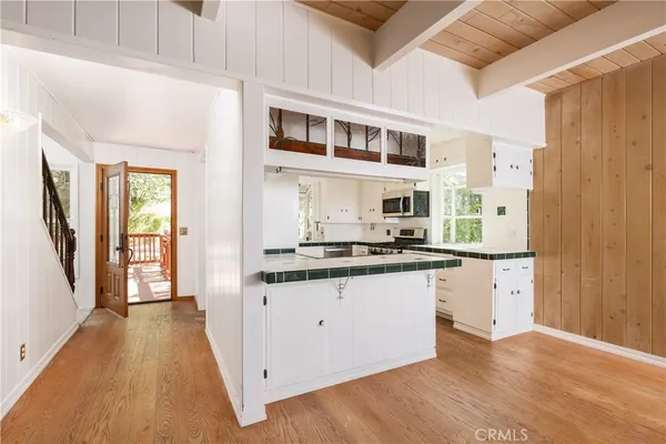 a kitchen with stainless steel appliances granite countertop a stove and a sink