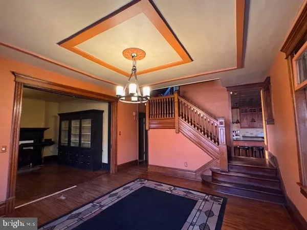 a view of backyard with a fireplace and wooden floor