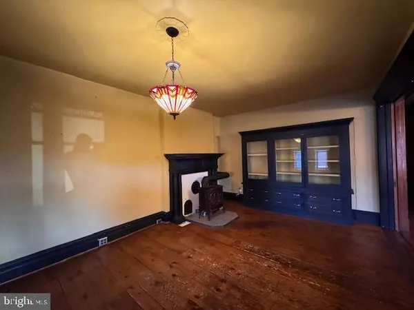 a kitchen with a stove a sink and a microwave