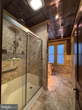 a kitchen with stainless steel appliances granite countertop a sink a stove and a wooden floors