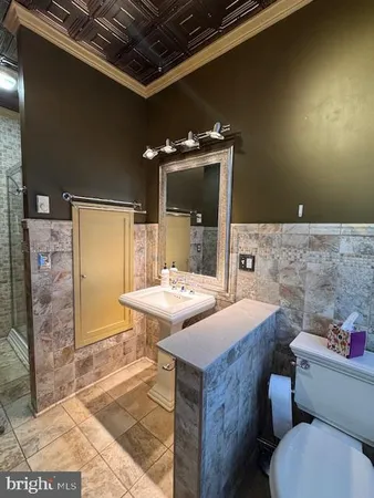 a kitchen with granite countertop a stove and a sink