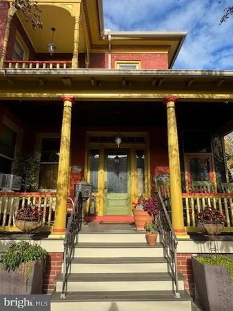 a front view of a house with a porch