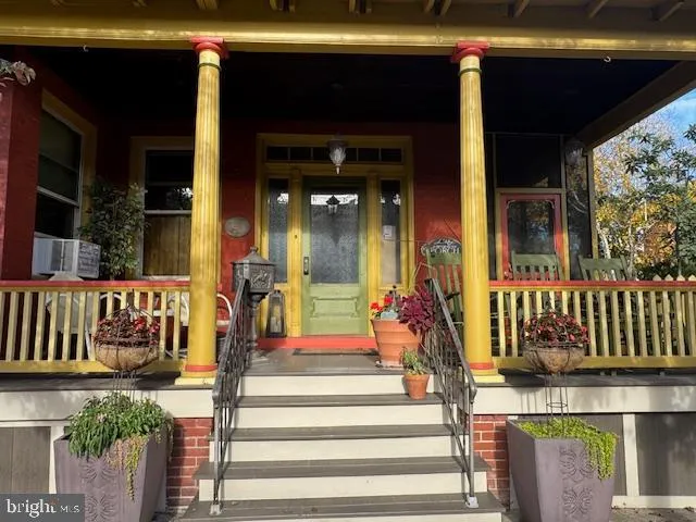 a front view of a house with a porch