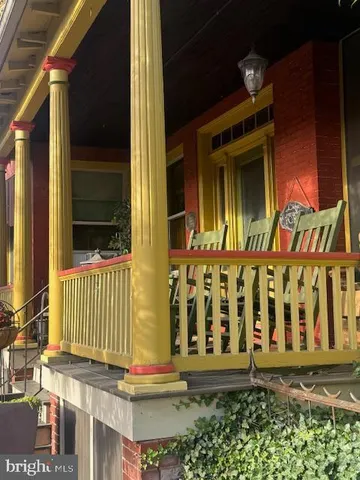 a front view of a house with a street