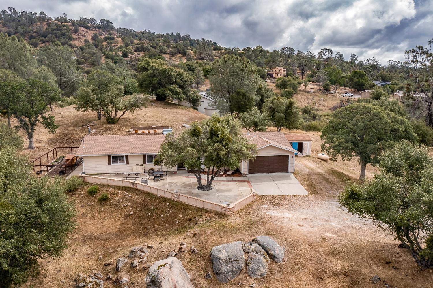 29395 Revis Road Coarsegold, CA 93614 - Photo 27 of 32 an aerial view of a house with a yard and garage