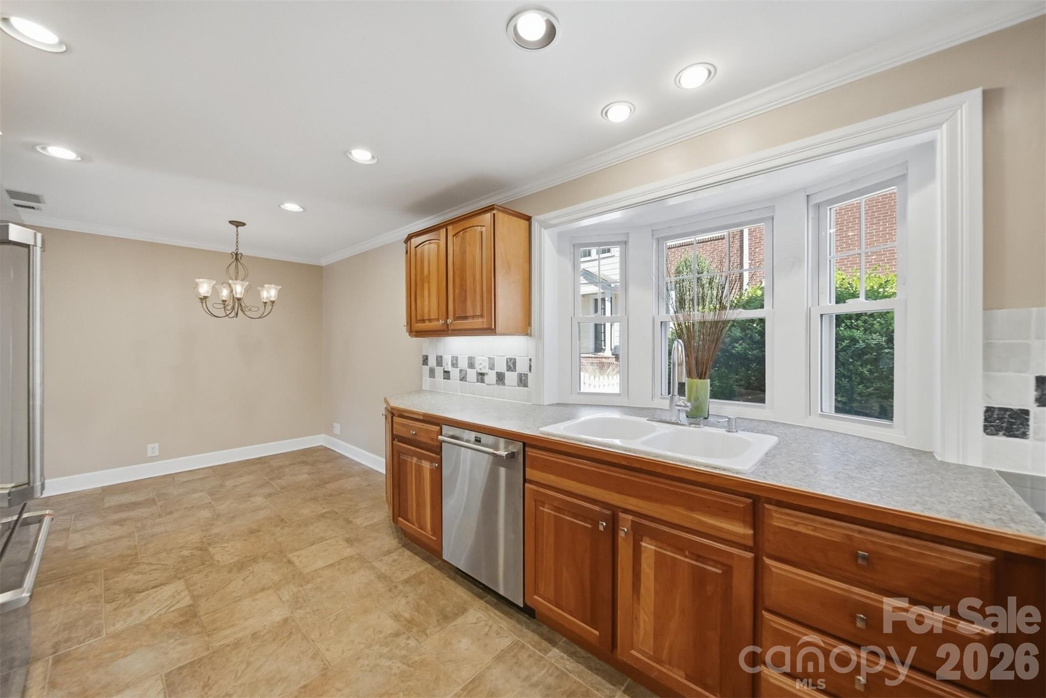 543 5th Street Northwest Hickory, NC 28601 - Photo 15 of 43 a large kitchen with stainless steel appliances granite countertop a sink and a large window