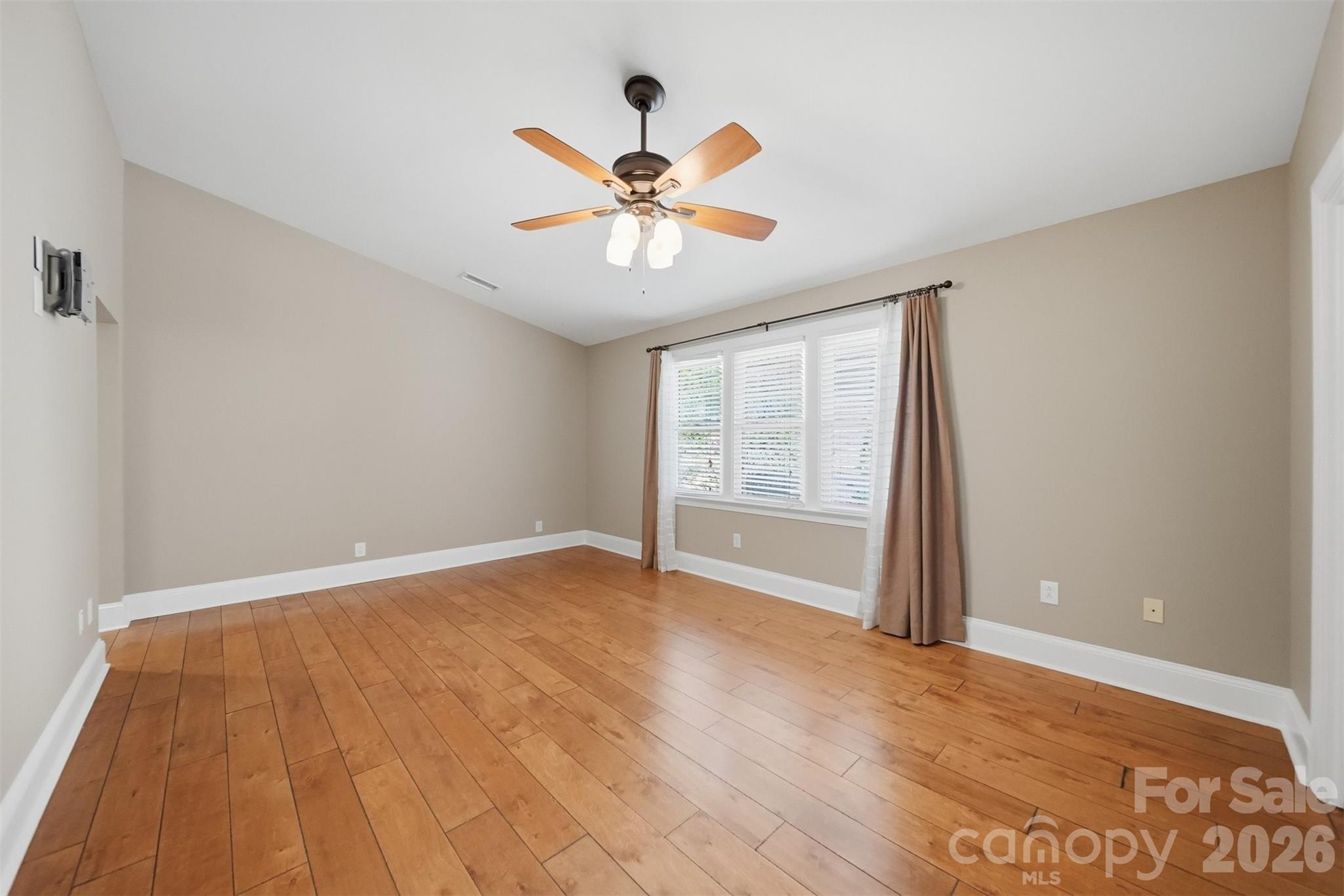 543 5th Street Northwest Hickory, NC 28601 - Photo 21 of 43 a view of an empty room with window and wooden floor