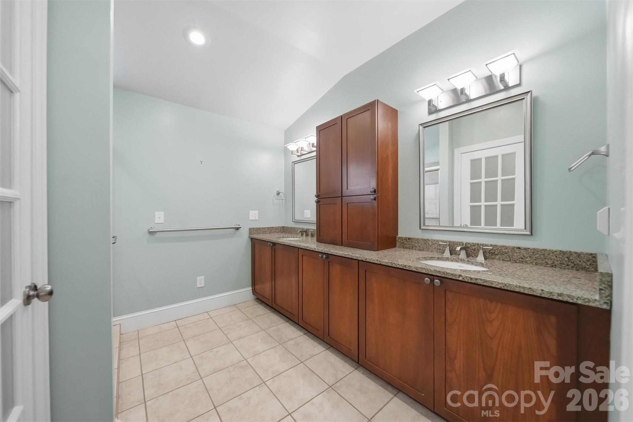 543 5th Street Northwest Hickory, NC 28601 - Photo 22 of 43 a bathroom with a granite countertop sink a mirror and a vanity