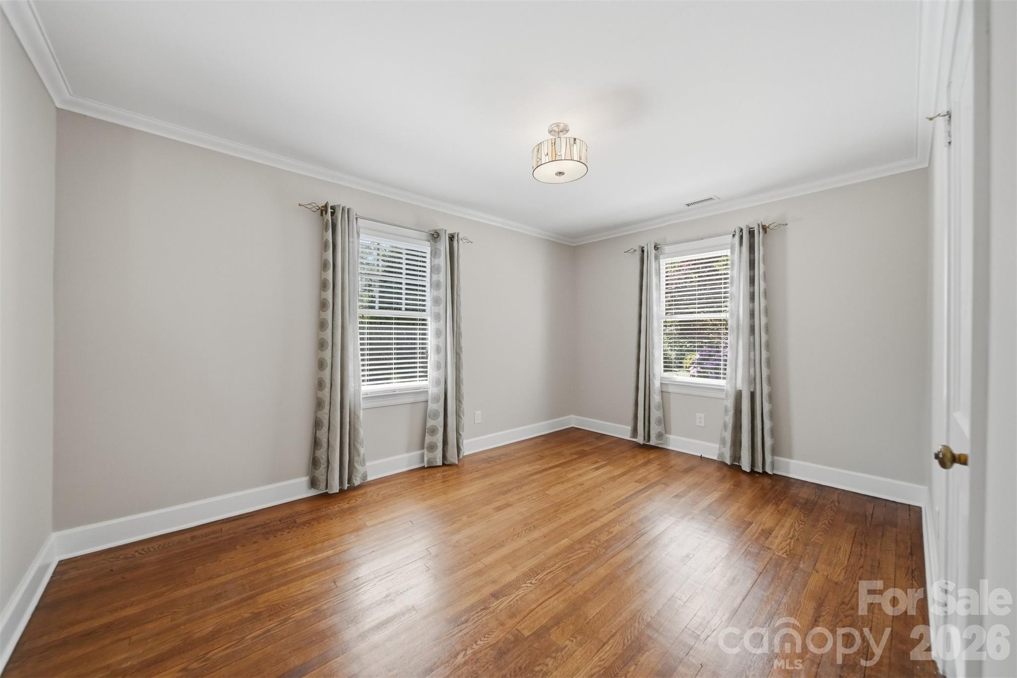 543 5th Street Northwest Hickory, NC 28601 - Photo 27 of 43 an empty room with wooden floor and windows