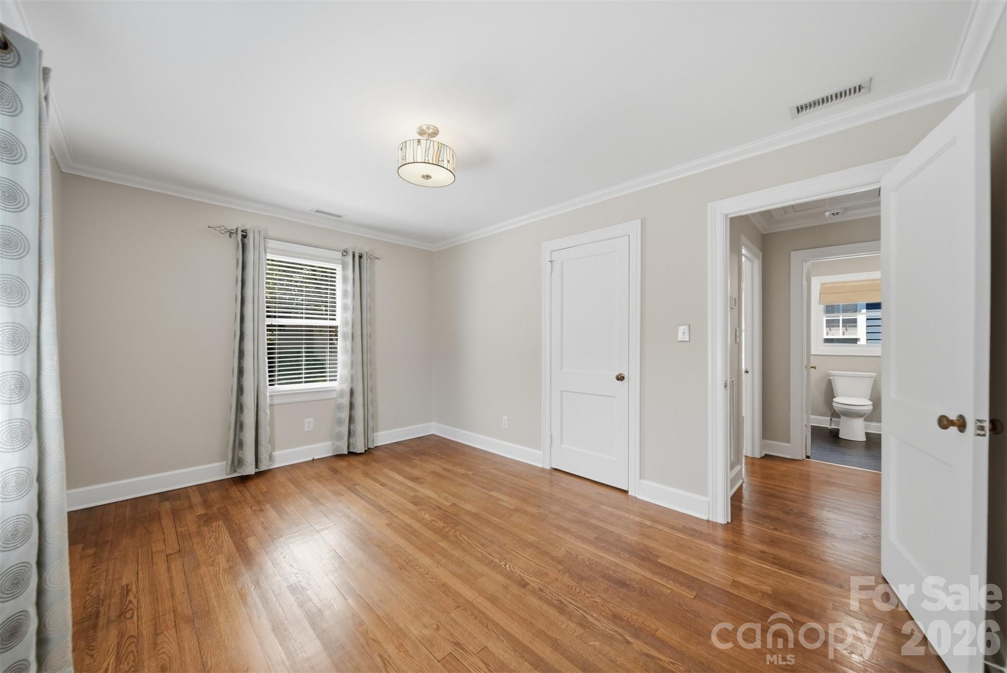543 5th Street Northwest Hickory, NC 28601 - Photo 28 of 43 wooden floor in an empty room with a window