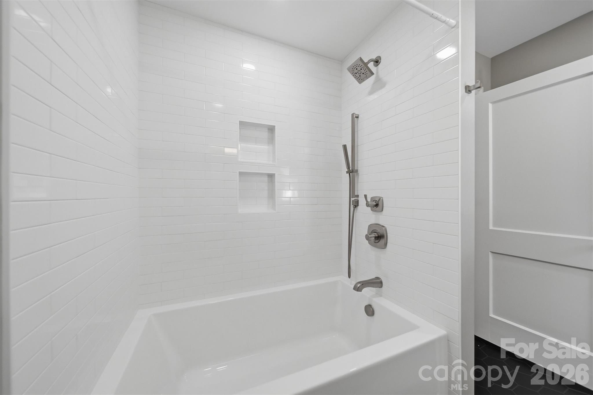 543 5th Street Northwest Hickory, NC 28601 - Photo 30 of 43 a bathroom with a bathtub and a shower