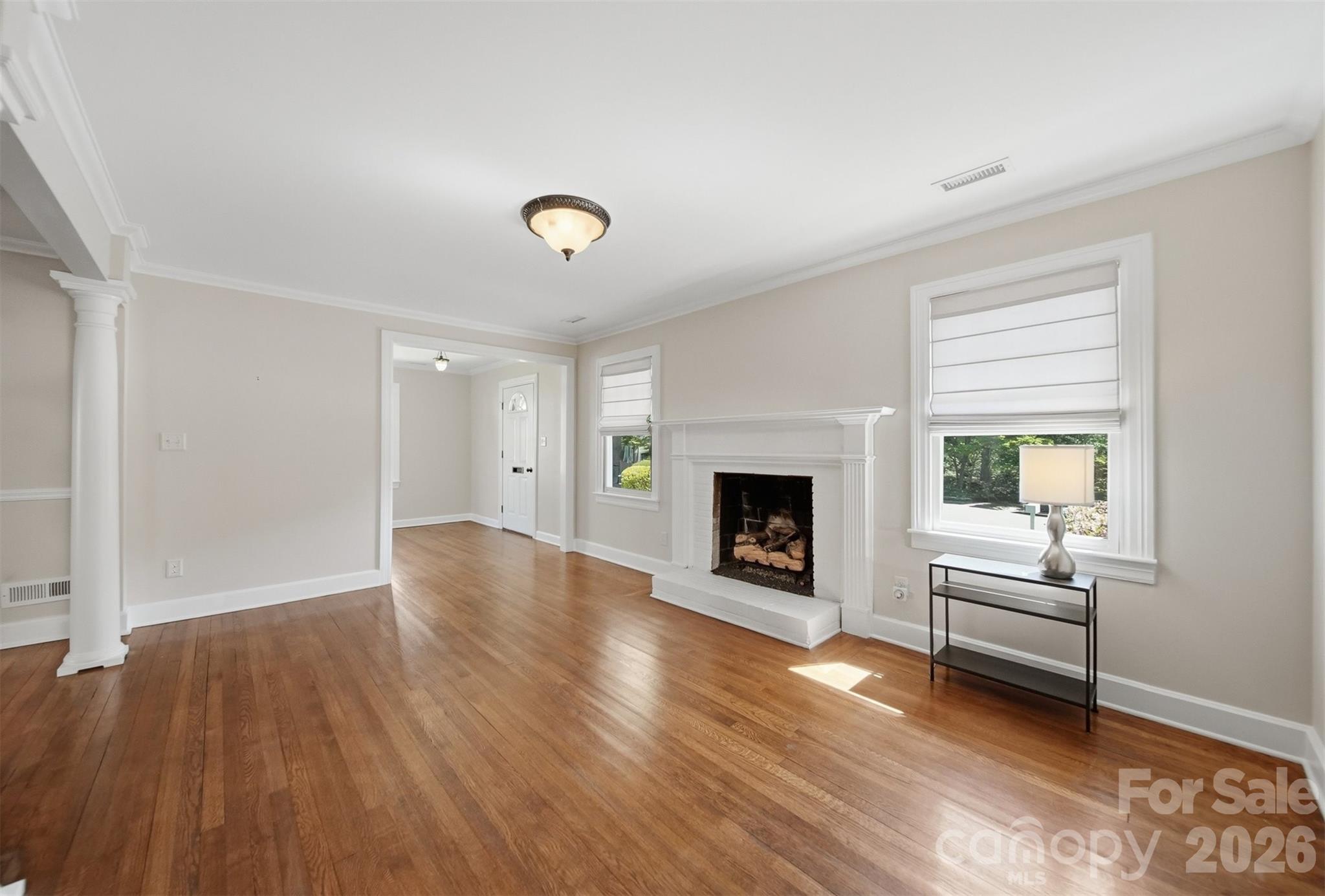543 5th Street Northwest Hickory, NC 28601 - Photo 4 of 43 an empty room with fireplace and wooden floor