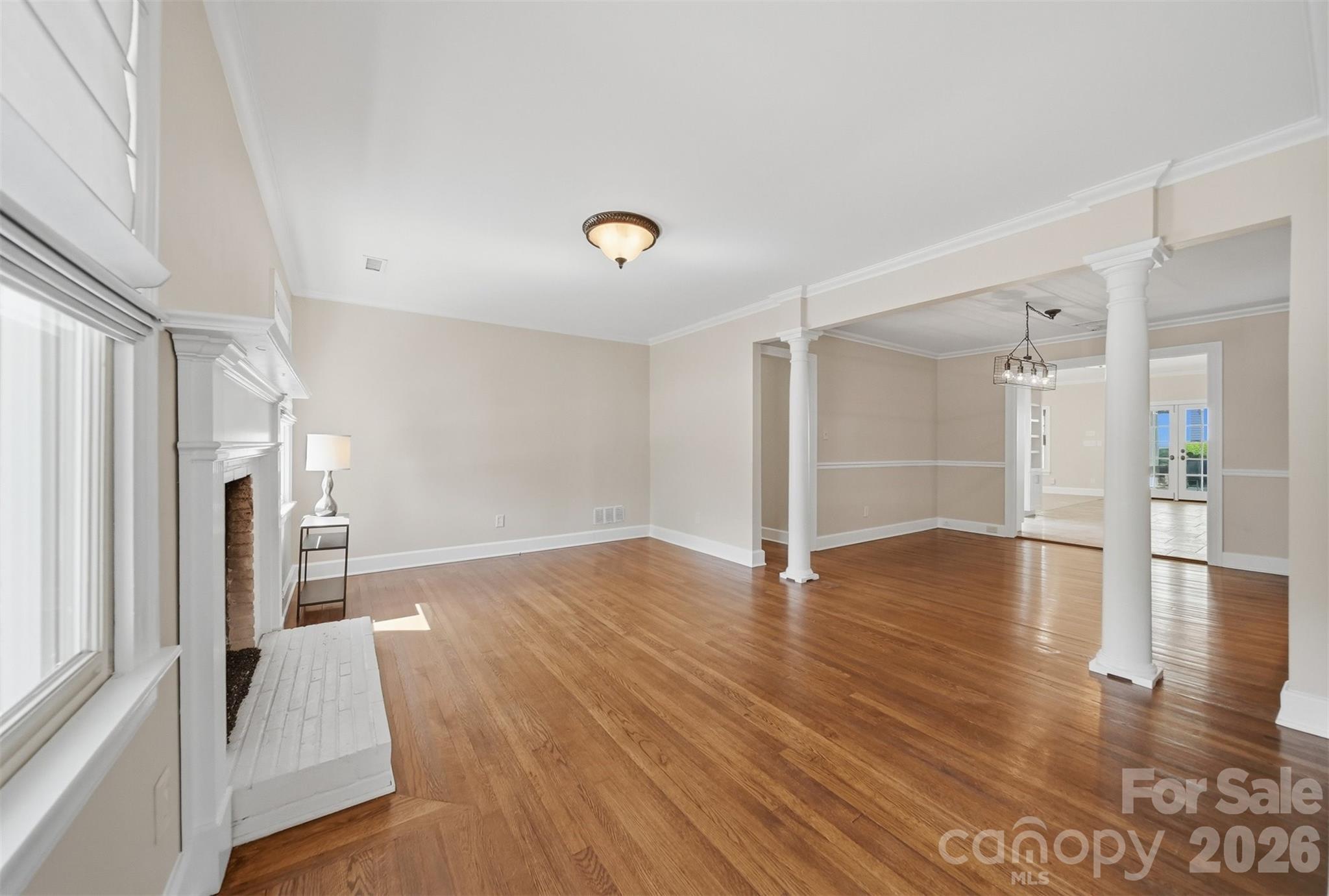 543 5th Street Northwest Hickory, NC 28601 - Photo 5 of 43 a view of empty room with wooden floor and window
