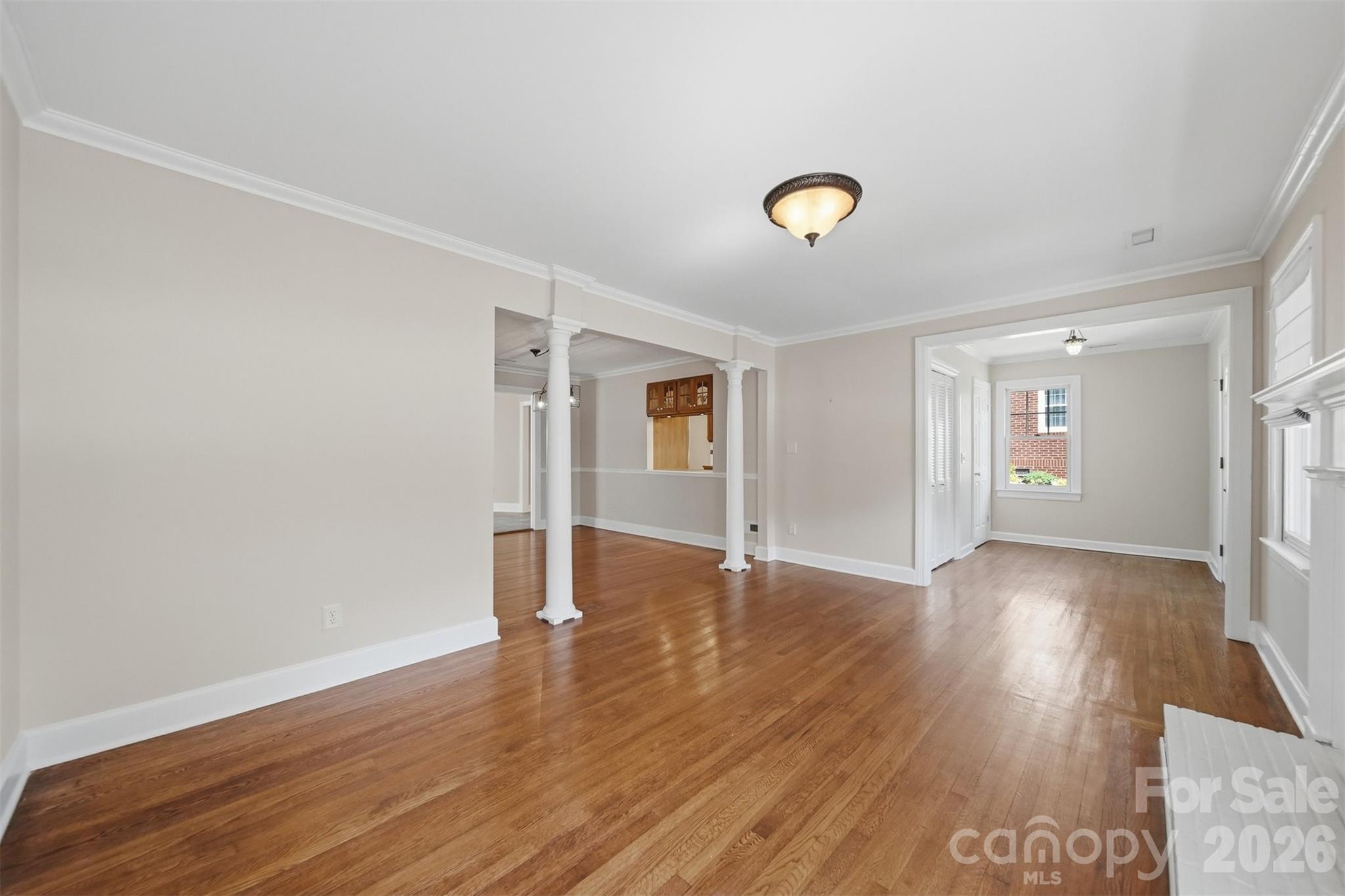 543 5th Street Northwest Hickory, NC 28601 - Photo 6 of 43 an empty room with wooden floor and windows
