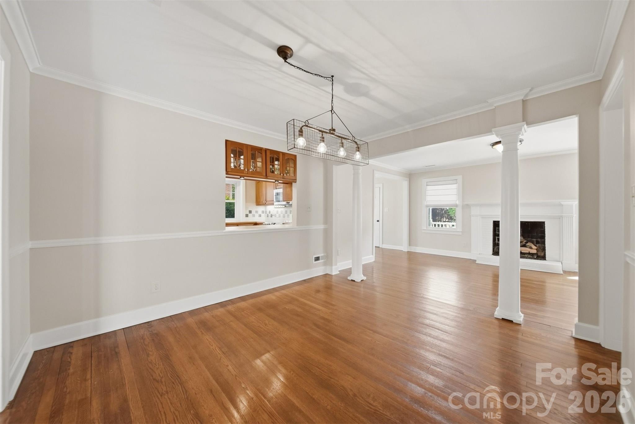 543 5th Street Northwest Hickory, NC 28601 - Photo 8 of 43 a view of a livingroom with wooden floor a ceiling fan and windows