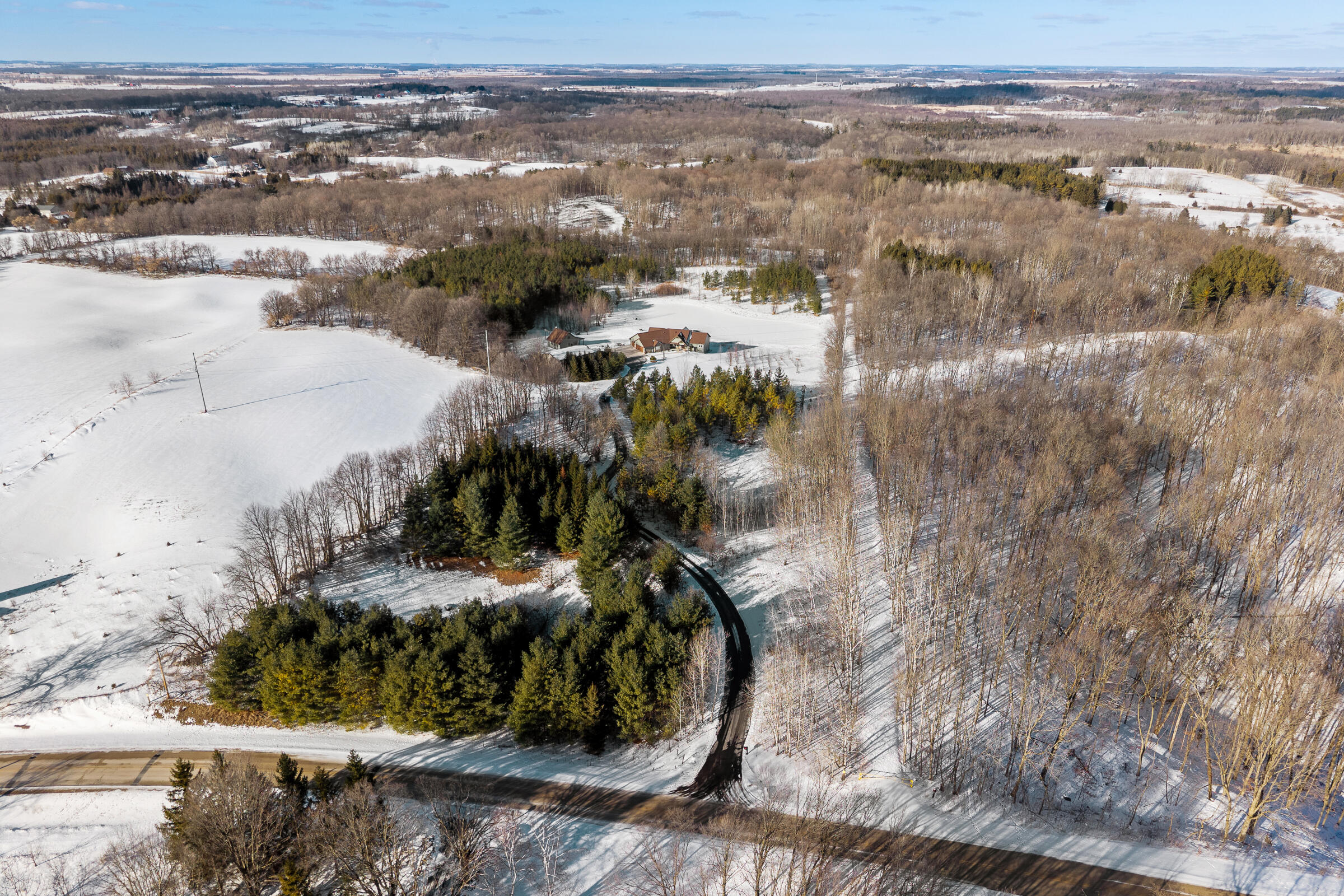 22428 West Steinthal Road Eaton, WI 53042 - Photo 72 of 81 Treelined and Blacktopped Driveway