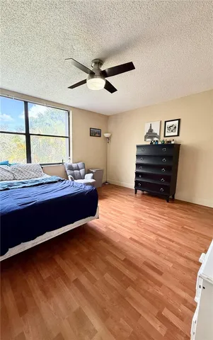 a bedroom with furniture and window