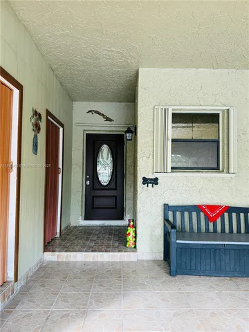 a view of a door and chair in the room