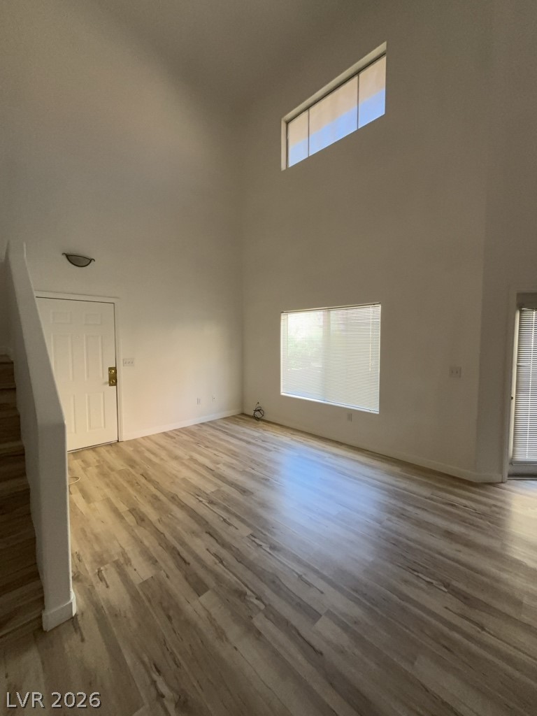 4915 East Russell Road, Unit 143 Las Vegas, NV 89120 - Photo 2 of 10 Natural light floods this room, highlighting the clean, modern flooring.
