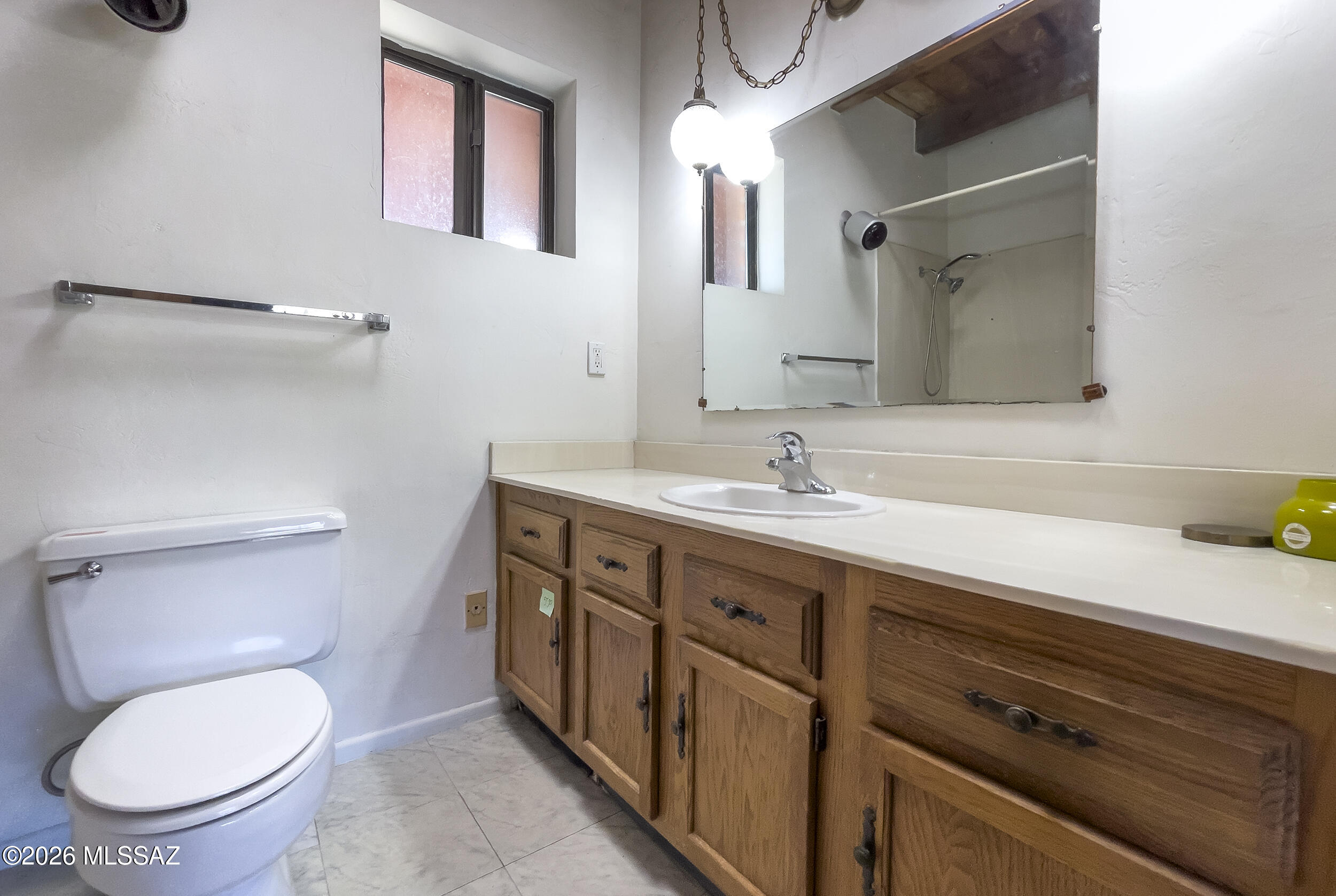 4130 East River Road Tucson, AZ 85718 - Photo 40 of 46 a spacious bathroom with a granite countertop toilet sink and mirror