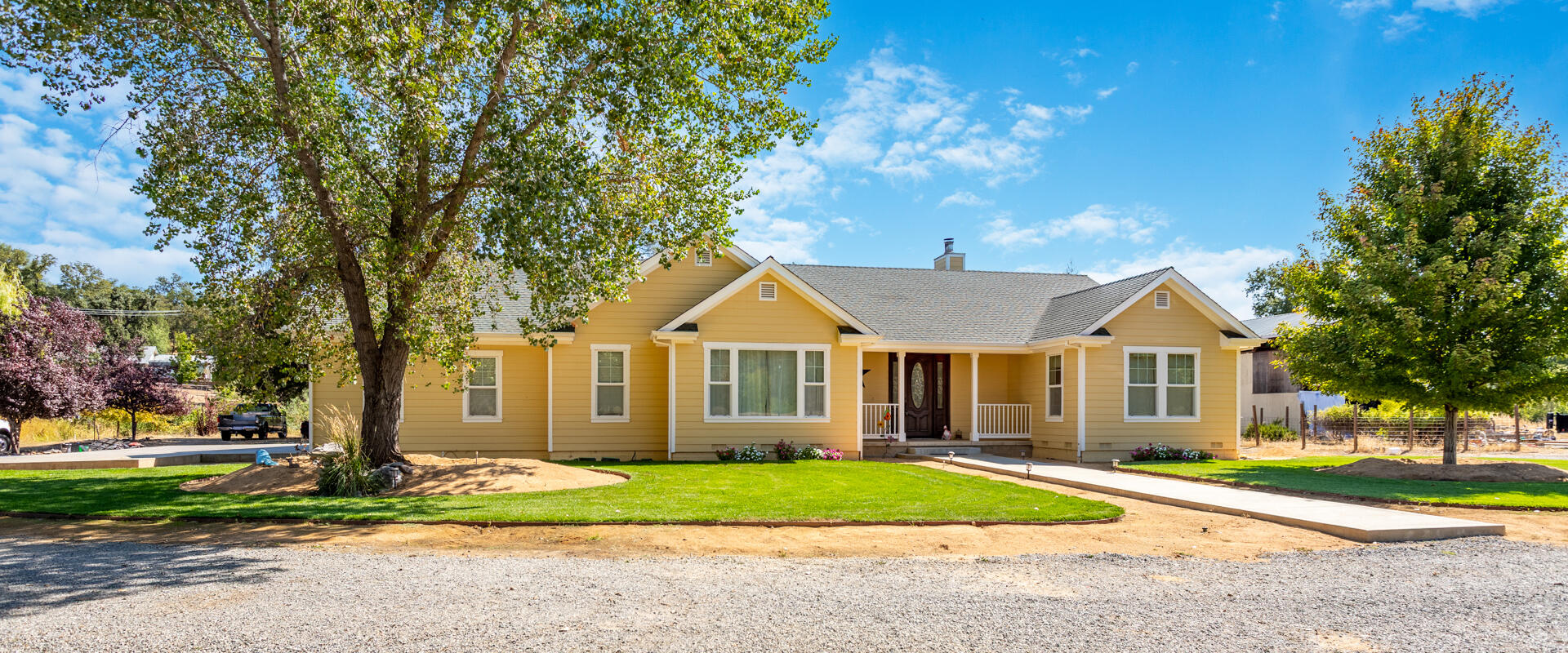 front view of a house next to a yard