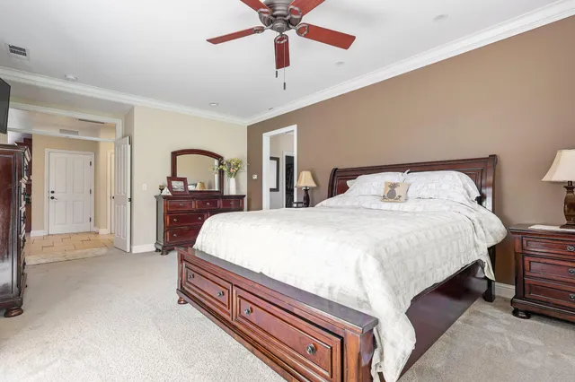 a bed room with a bed and a chandelier