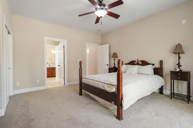 a bed room with a bed and a chandelier