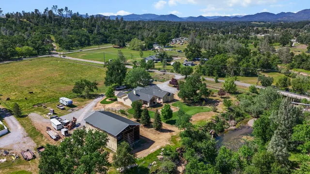 an aerial view of a house with a garden