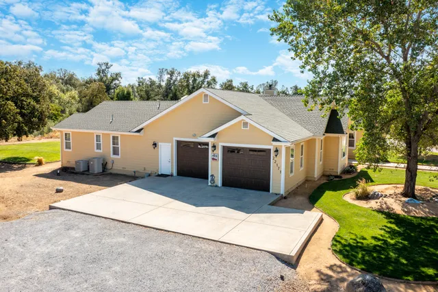 a aerial view of a house with a yard