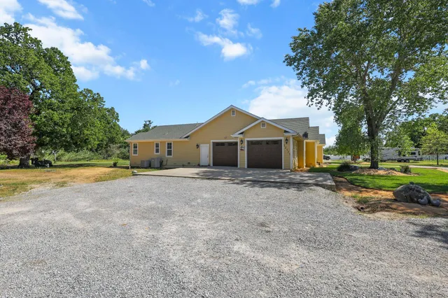 a front view of house with a yard and garage