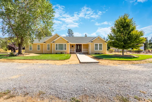 a house with garden in front of it
