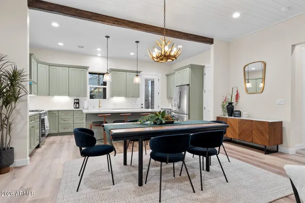 a large kitchen with kitchen island a sink stainless steel appliances and cabinets