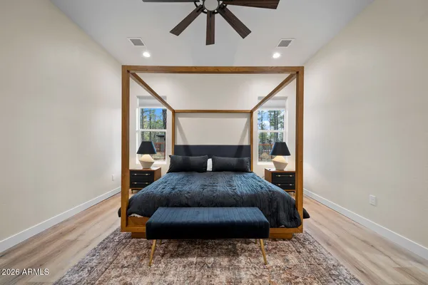 a white toilet sitting next to a bathroom sink