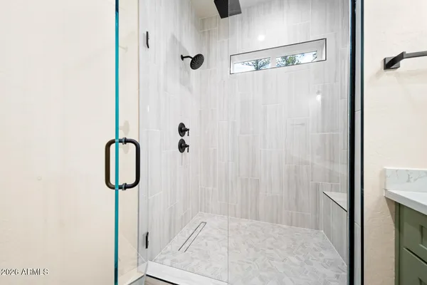 a bedroom with a bed and a table