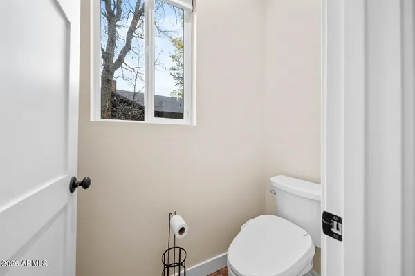 a bedroom with bed and a window