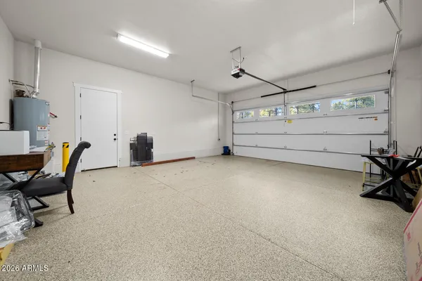 a view of a porch with furniture and a yard