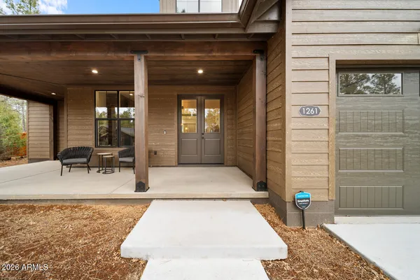 a view of a porch with a wooden door