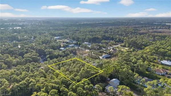 an aerial view of house with yard