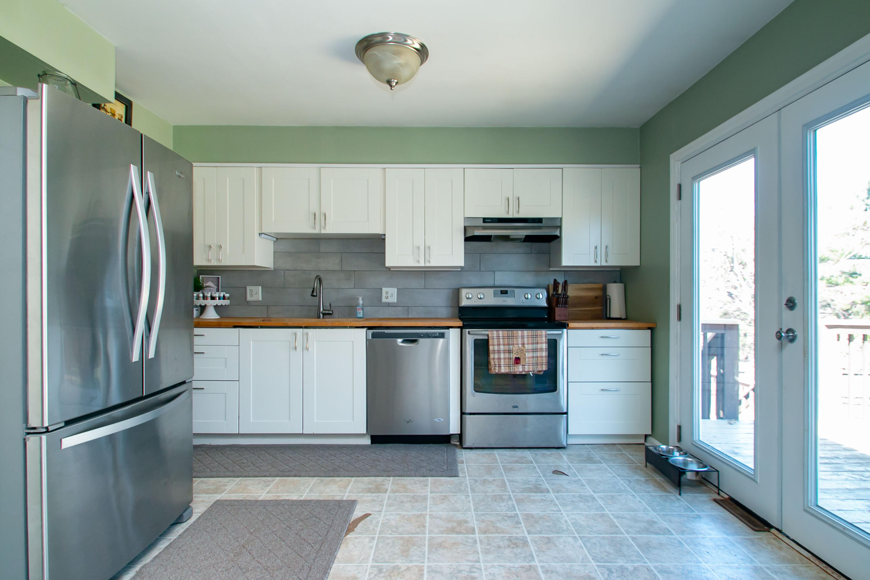 3022 Bandy Road Roanoke, VA 24014 - Photo 10 of 50 a kitchen with stainless steel appliances granite countertop a refrigerator a stove and a sink