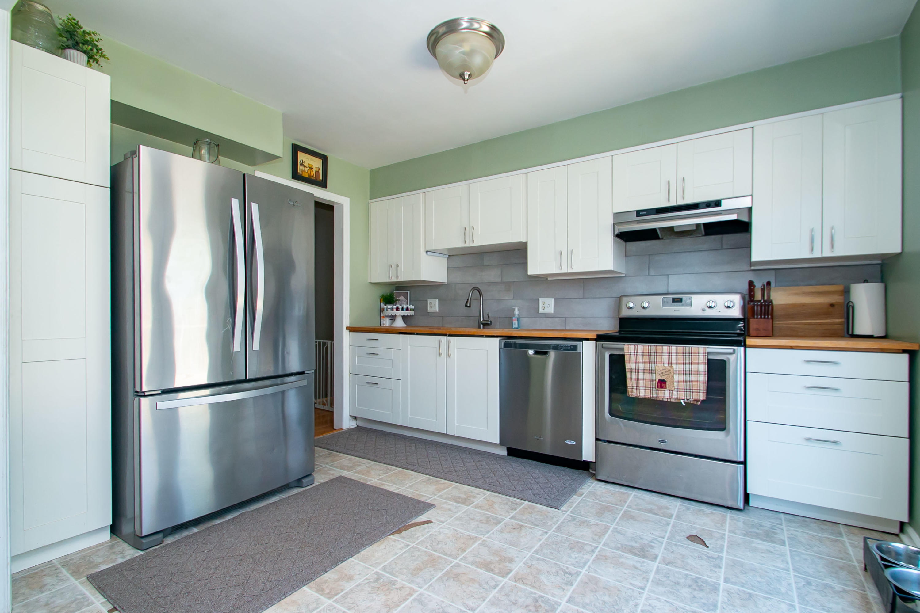 3022 Bandy Road Roanoke, VA 24014 - Photo 11 of 50 a kitchen with stainless steel appliances granite countertop a refrigerator sink and stove