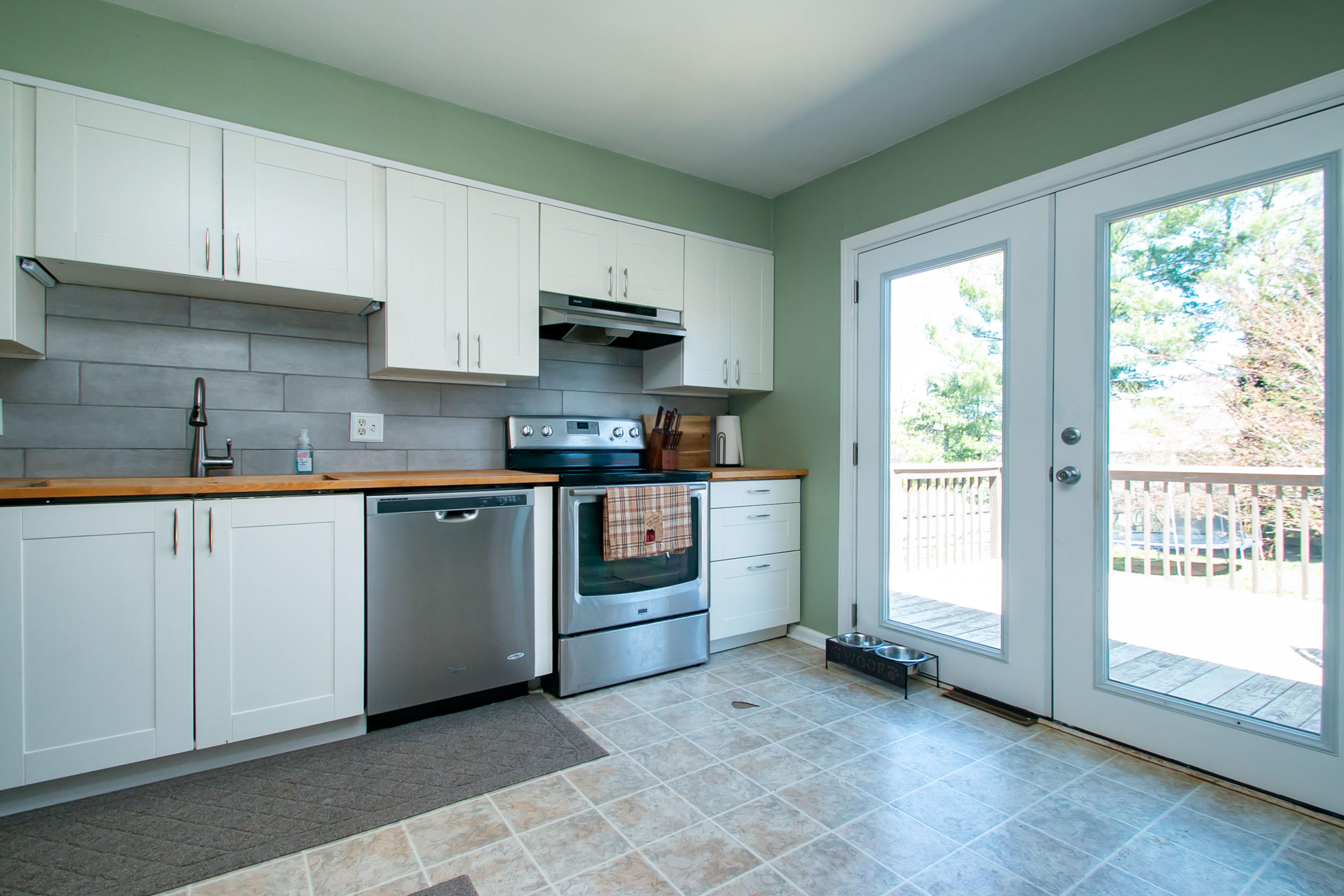 3022 Bandy Road Roanoke, VA 24014 - Photo 13 of 50 a kitchen with stainless steel appliances granite countertop a stove a sink and a refrigerator