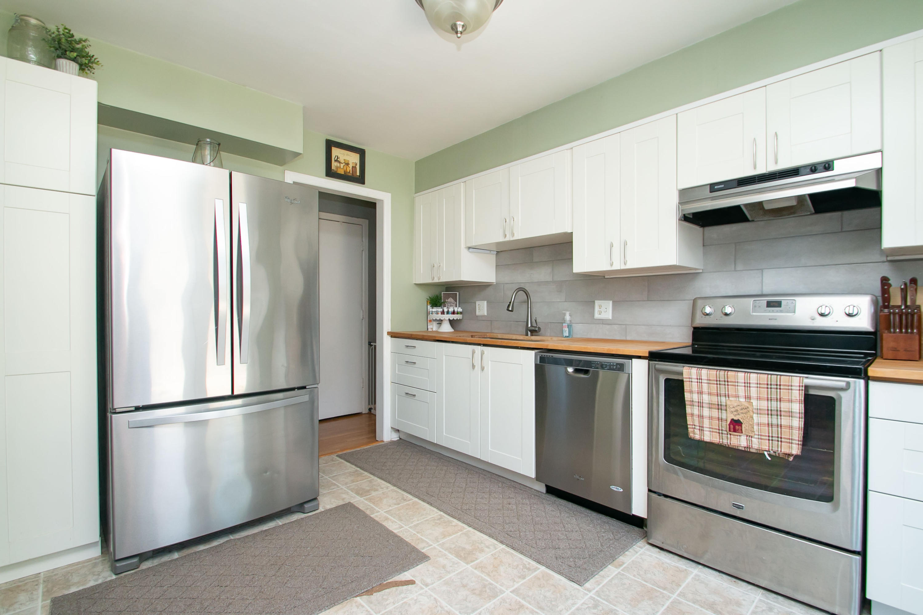 3022 Bandy Road Roanoke, VA 24014 - Photo 16 of 50 a kitchen with stainless steel appliances granite countertop a refrigerator a stove a sink and a cabinets
