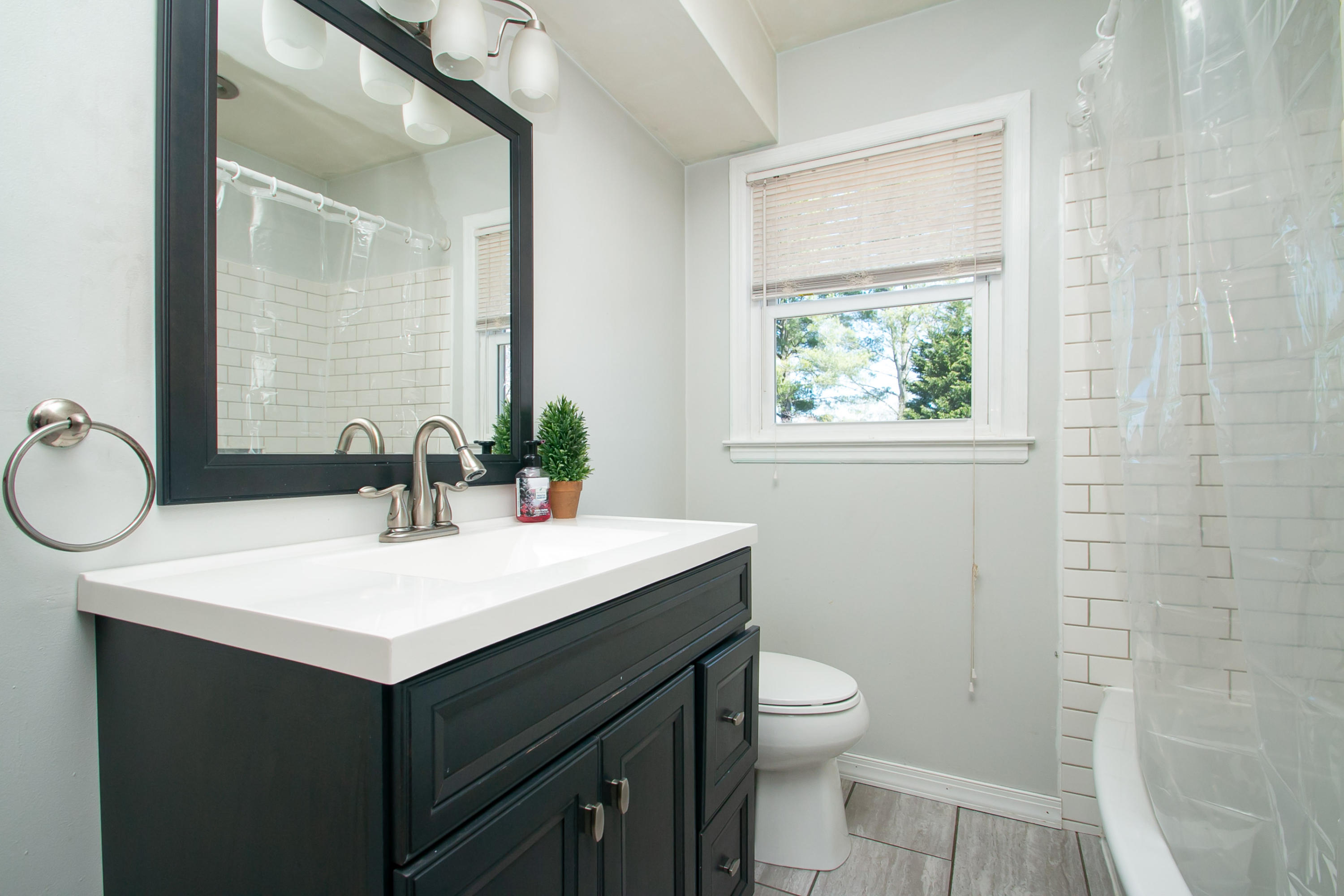 3022 Bandy Road Roanoke, VA 24014 - Photo 22 of 50 a bathroom with a granite countertop sink toilet and mirror