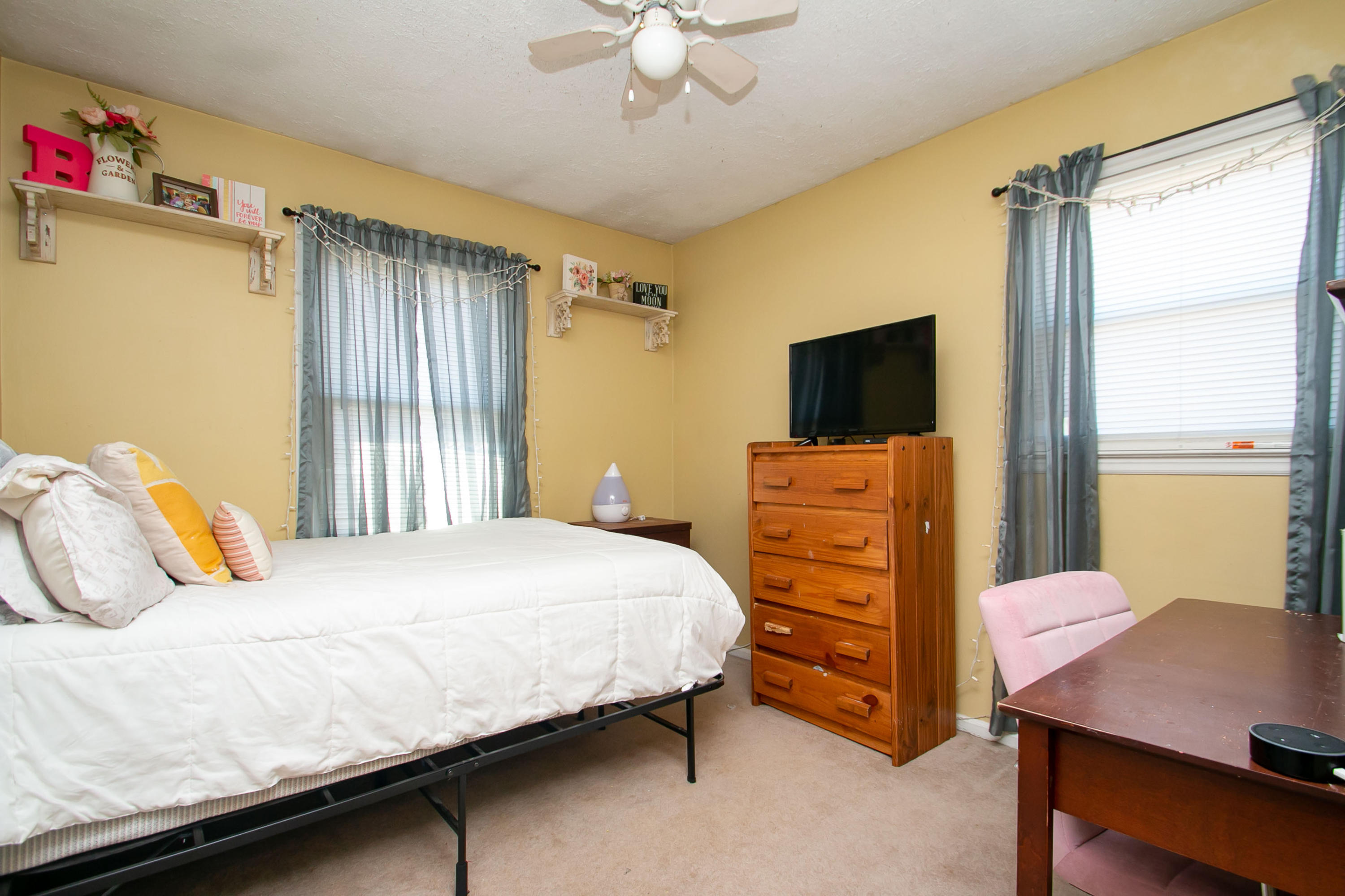 3022 Bandy Road Roanoke, VA 24014 - Photo 23 of 50 a bedroom with a bed and a flat tv screen on dresser