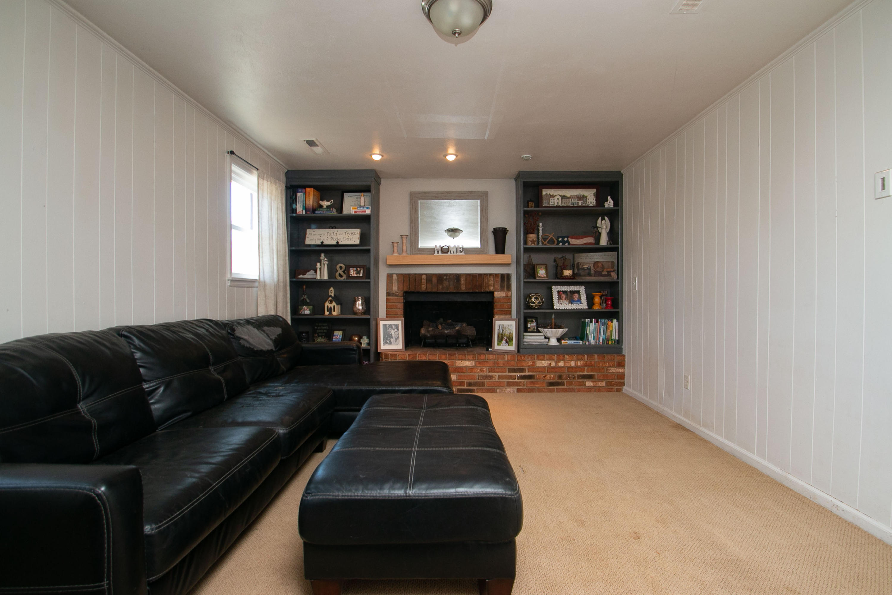 3022 Bandy Road Roanoke, VA 24014 - Photo 30 of 50 a living room with furniture and a fireplace