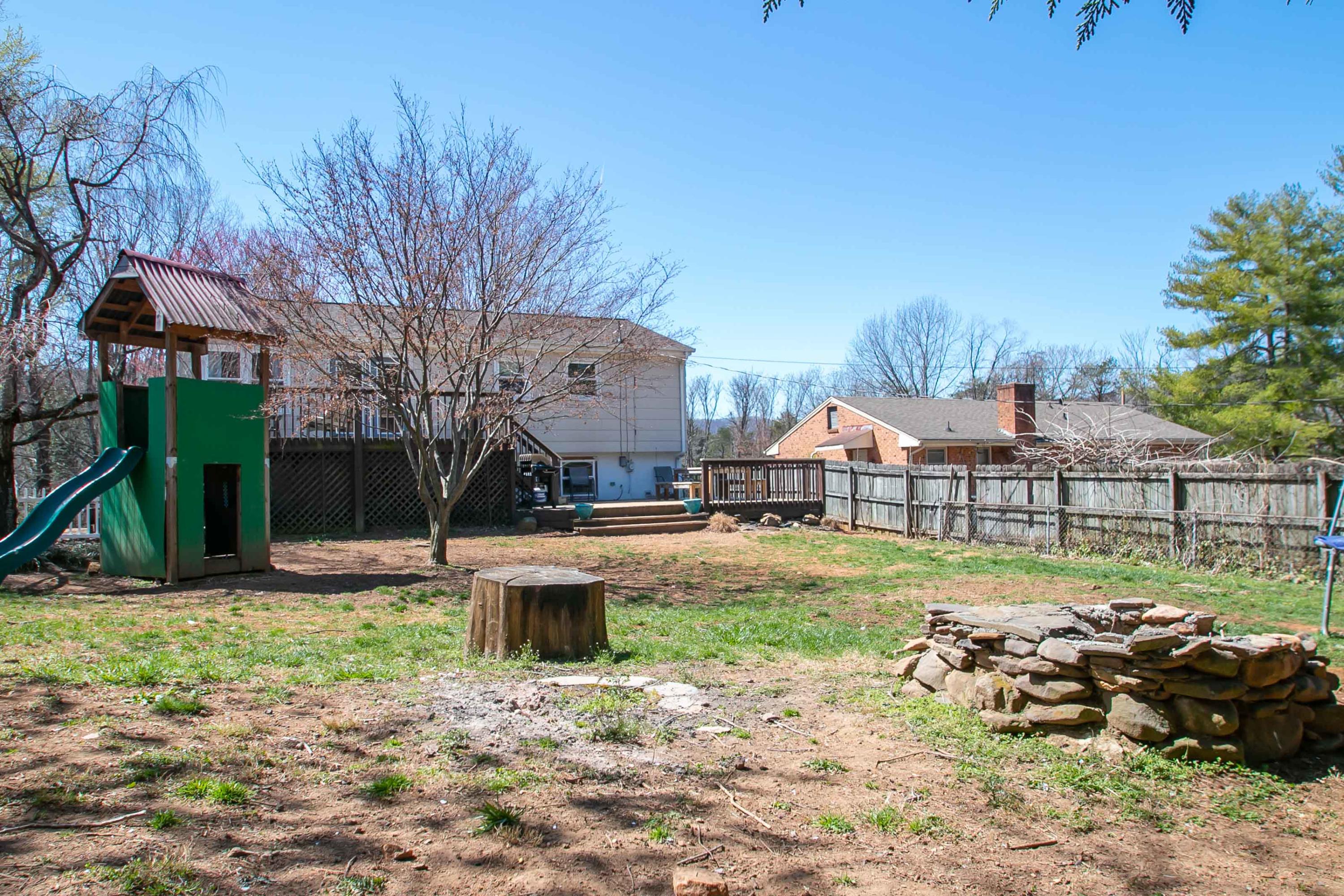 3022 Bandy Road Roanoke, VA 24014 - Photo 46 of 50 a view of a backyard with table and chairs potted plants and large tree